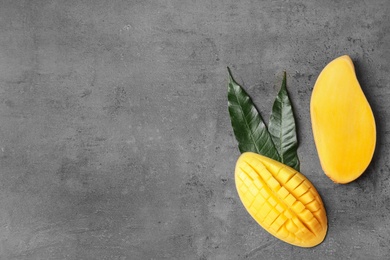 Photo of Flat lay composition with mango on grey background. Space for text