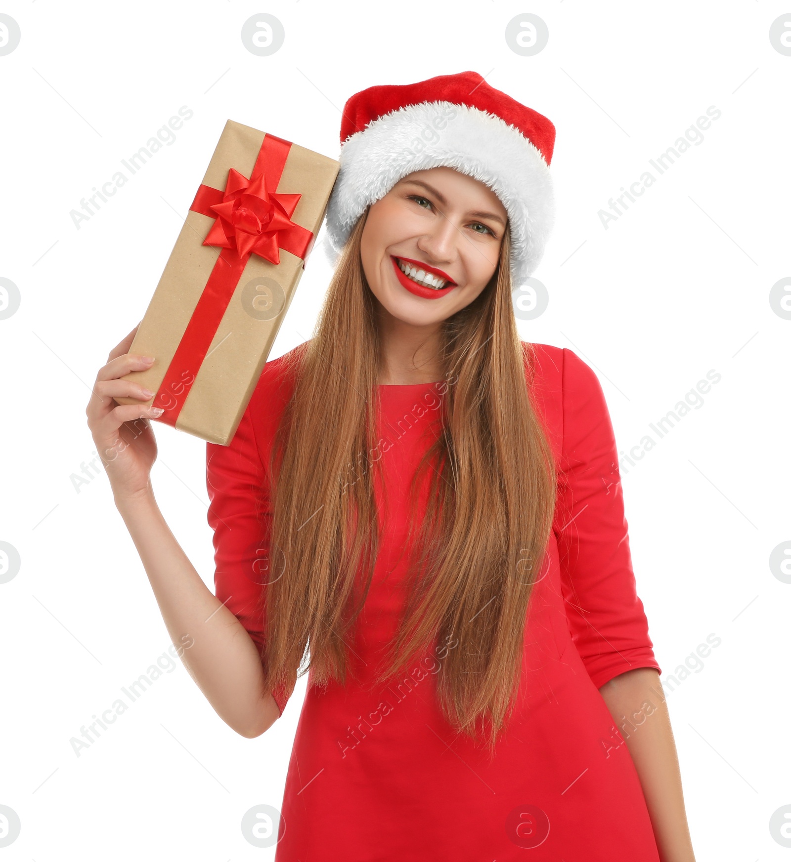 Photo of Young beautiful woman in Santa hat with gift box on white background. Christmas celebration