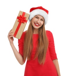 Photo of Young beautiful woman in Santa hat with gift box on white background. Christmas celebration