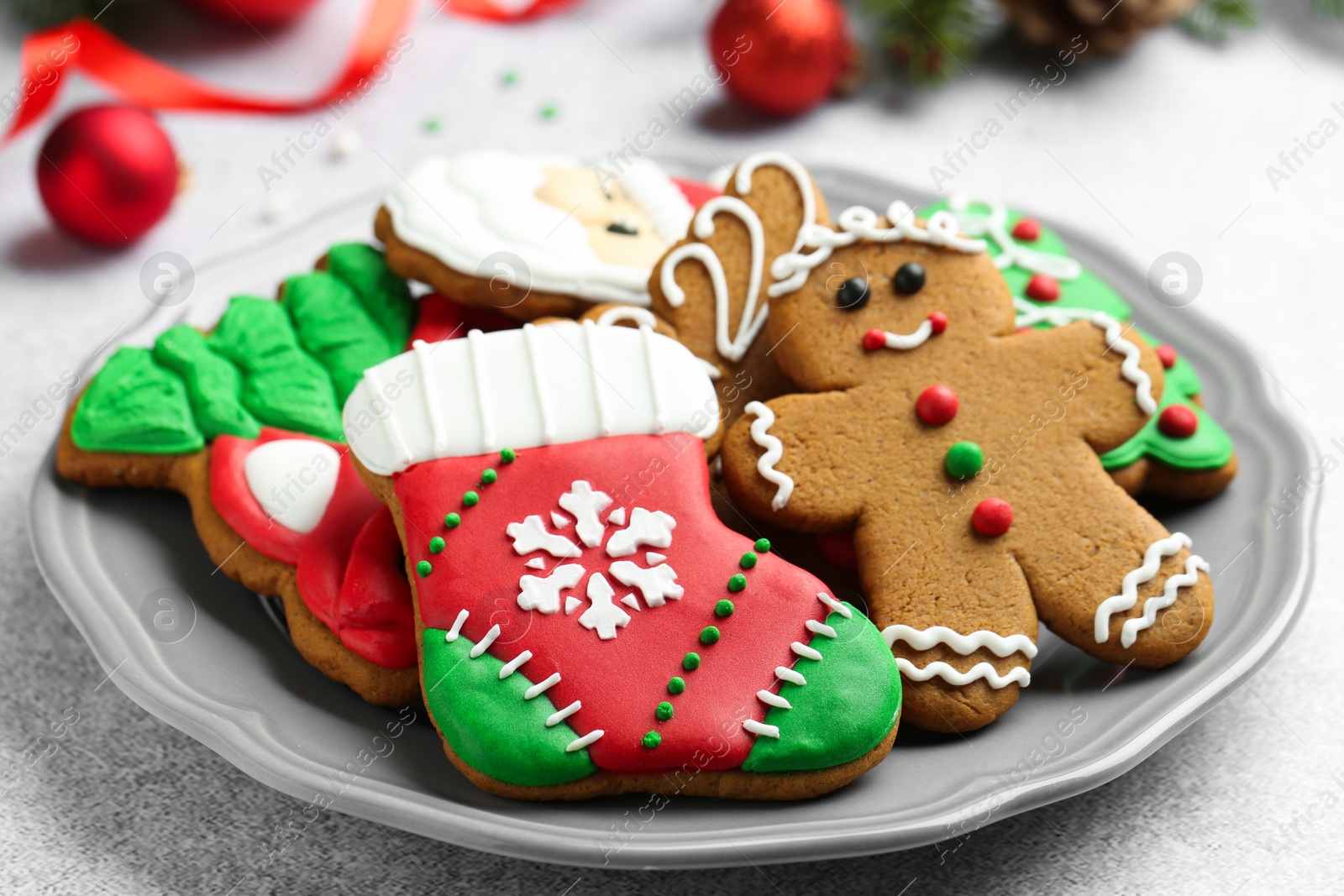 Photo of Tasty homemade Christmas cookies on light grey table, closeup