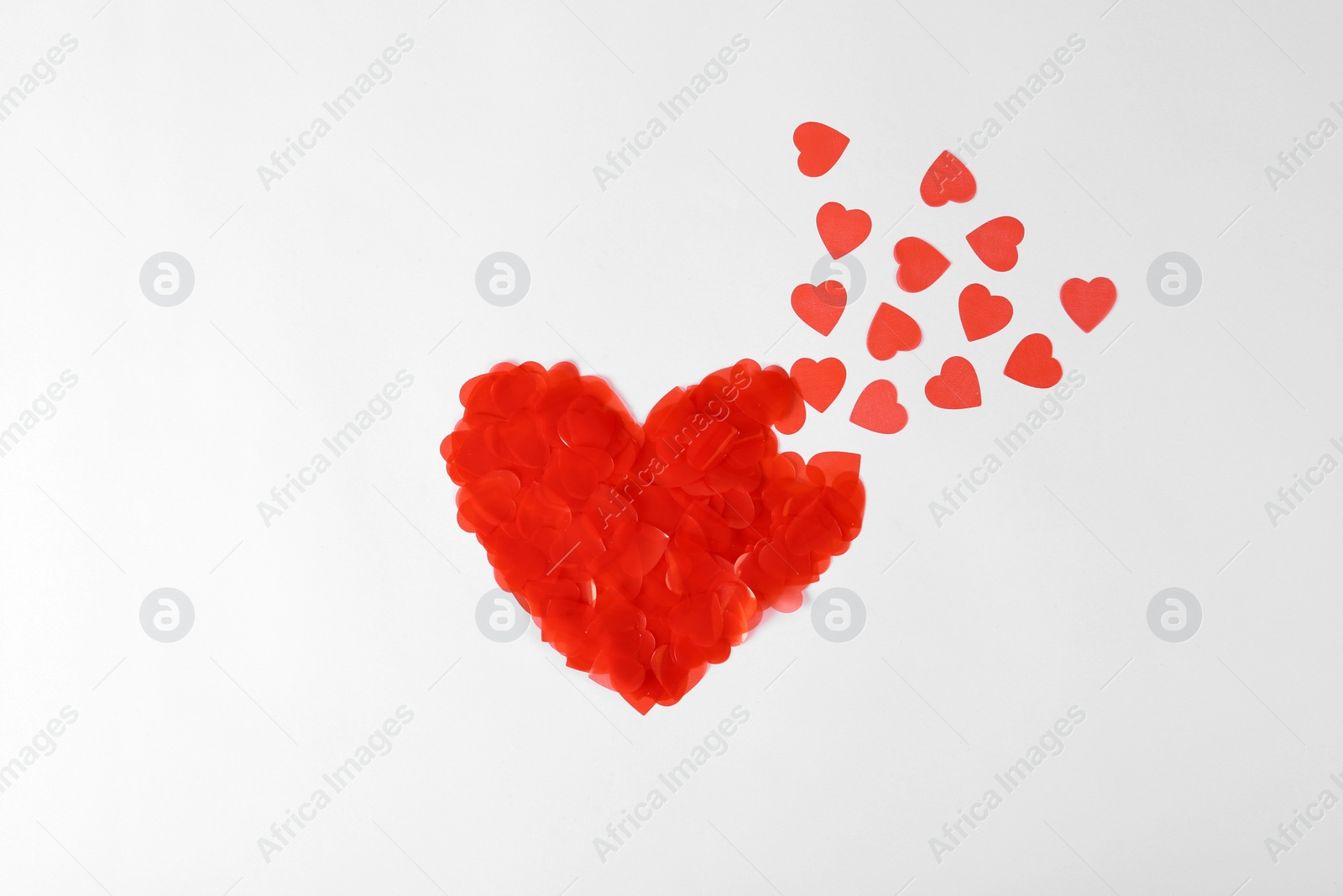 Photo of Composition with decorative red hearts on white background, top view