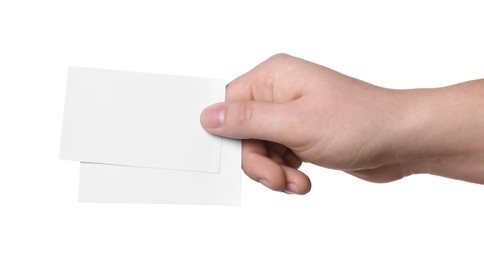 Woman holding paper cards on white background, closeup. Mockup for design