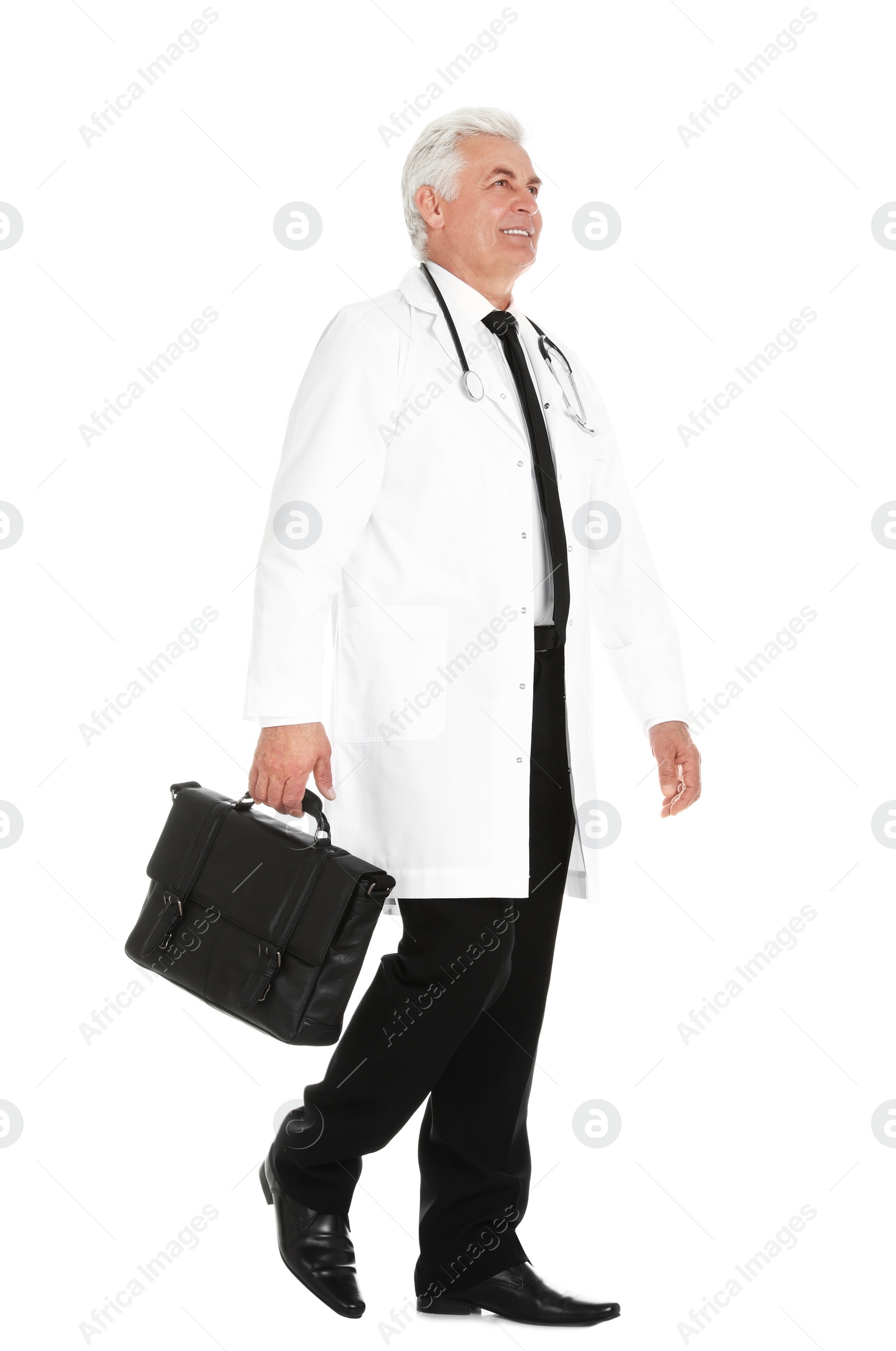 Photo of Full length portrait of male doctor with briefcase isolated on white. Medical staff