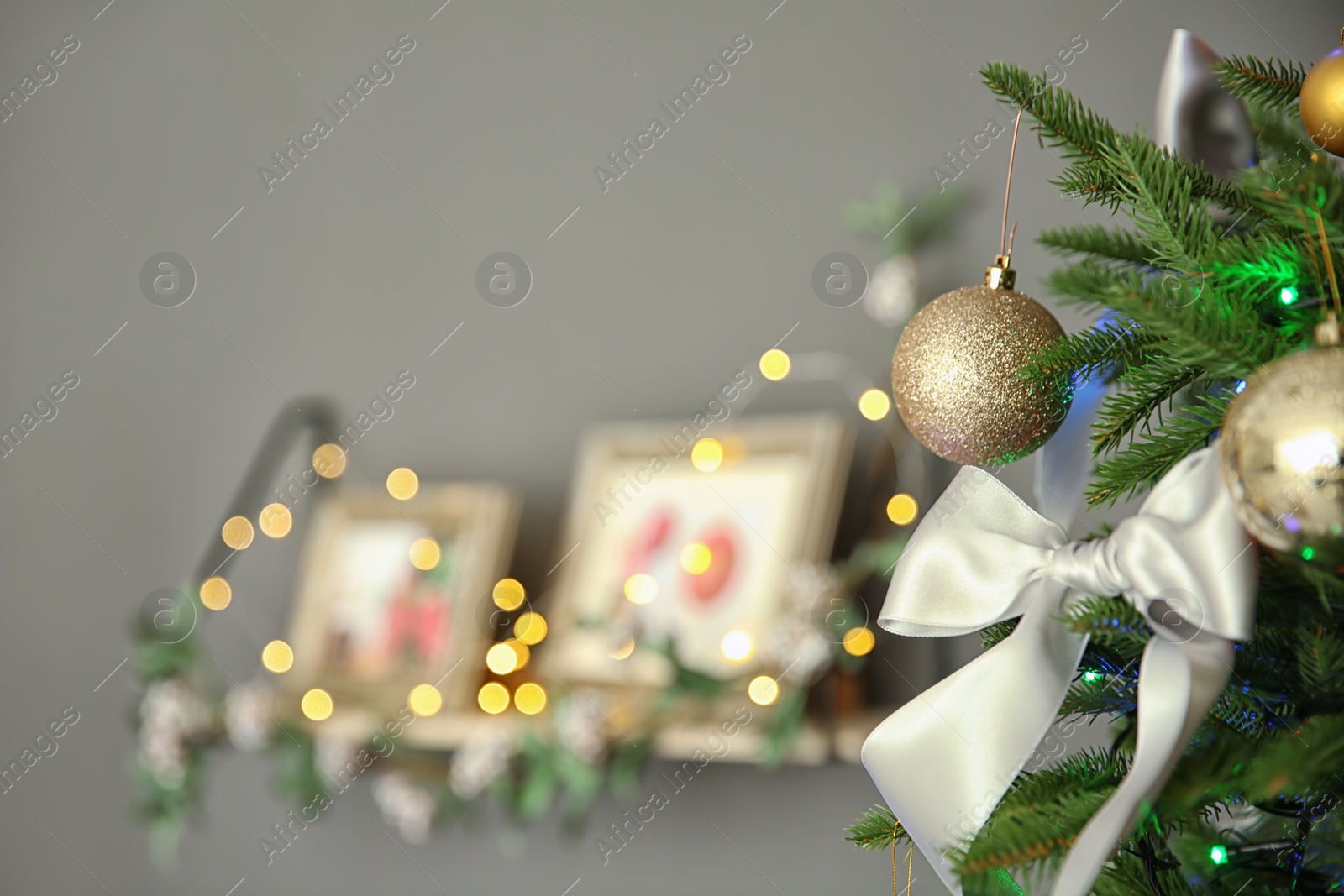 Photo of Christmas tree with stylish decor indoors, closeup