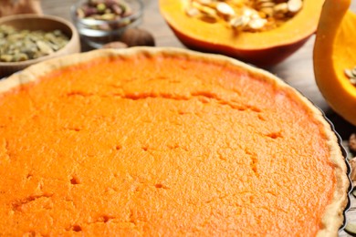 Photo of Delicious homemade pumpkin pie on table, closeup