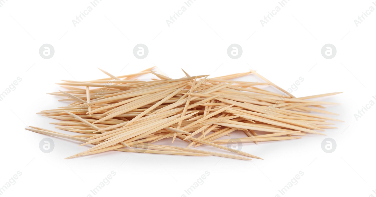 Photo of Heap of wooden toothpicks on white background