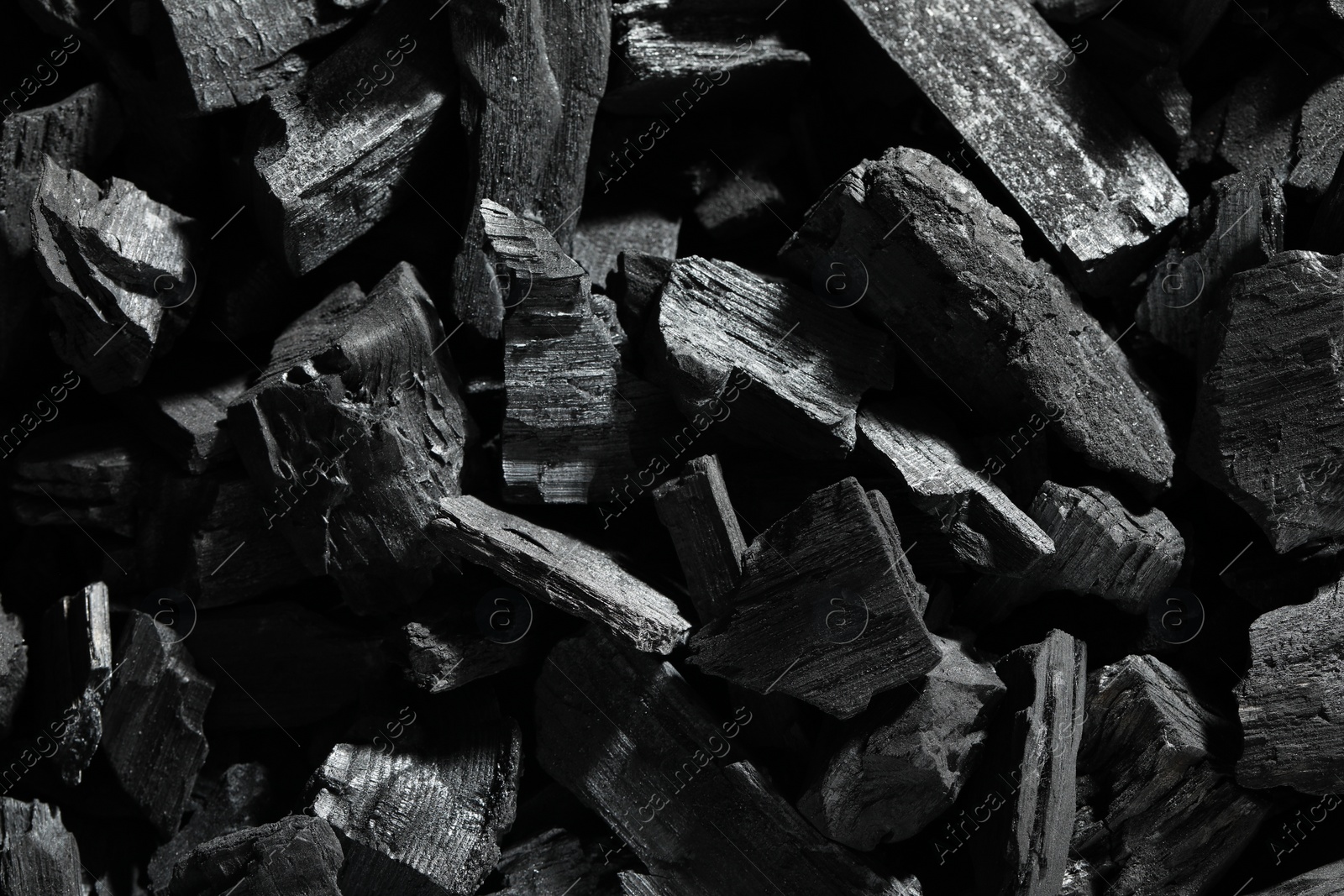 Photo of Heap of coal as background, top view