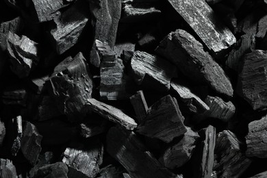 Photo of Heap of coal as background, top view