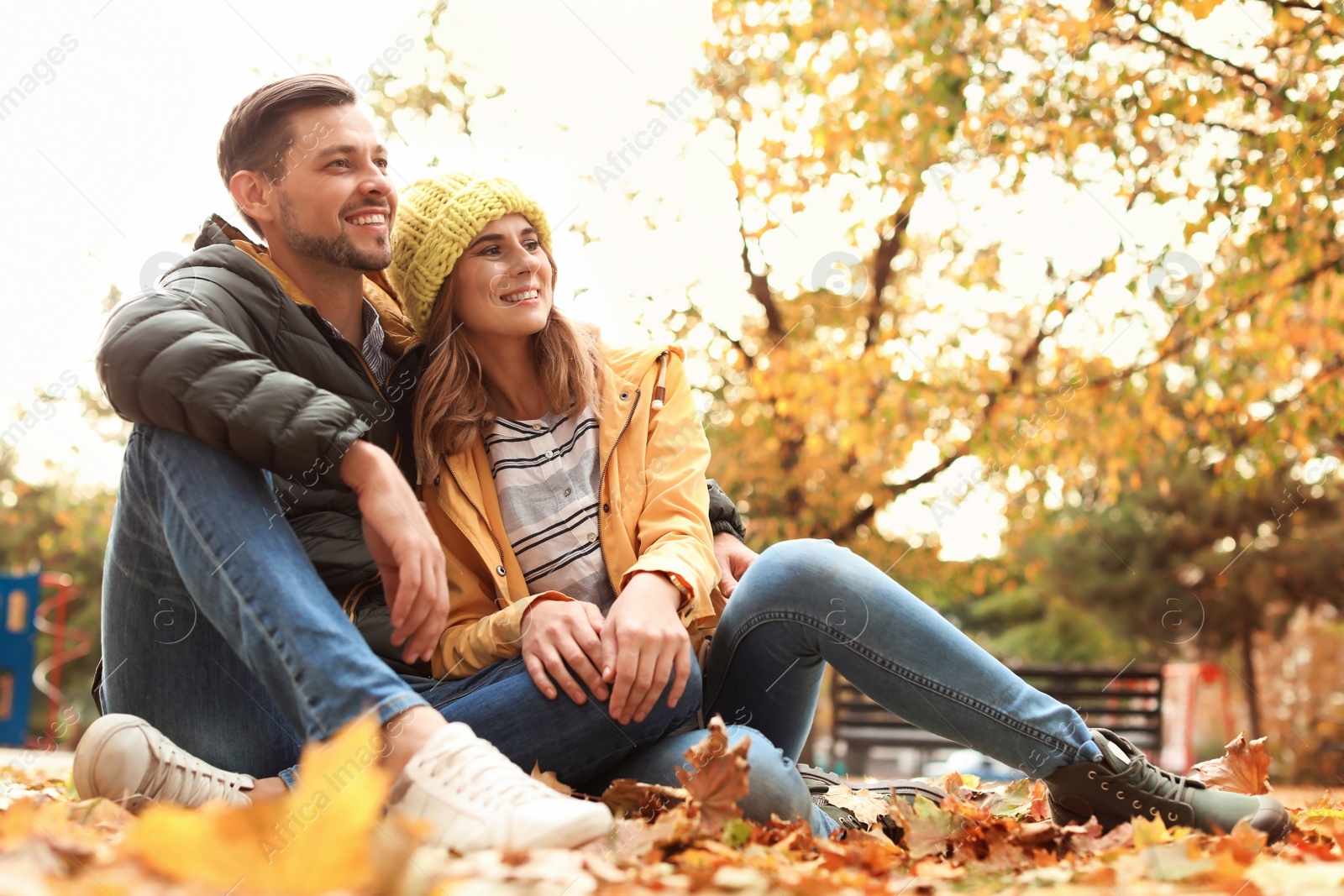 Photo of Lovely couple spending time together in park. Autumn walk