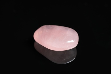Beautiful pink quartz gemstone on black background