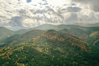 Aerial view of beautiful mountains on cloudy day