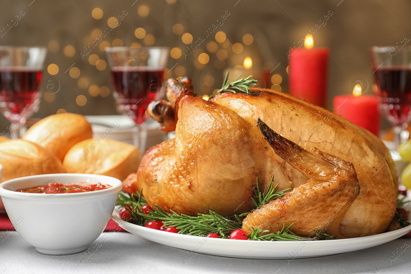 Photo of Traditional festive dinner with delicious roasted turkey served on table