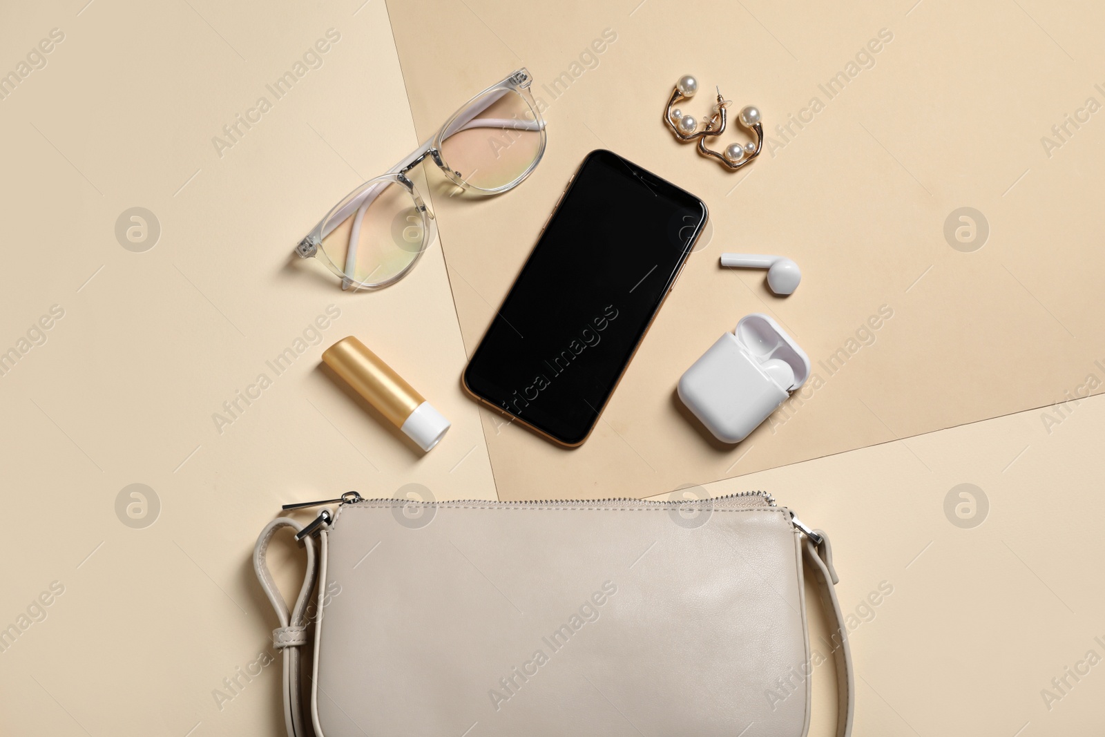 Photo of Flat lay composition with stylish woman's bag on color background