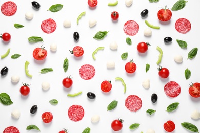 Flat lay composition with fresh ingredients for pizza on white background