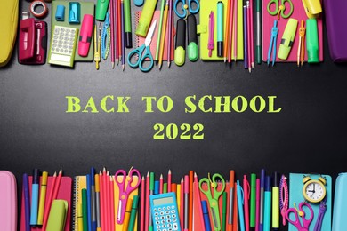 Image of Back to school 2022. Flat lay composition with different stationery on blackboard