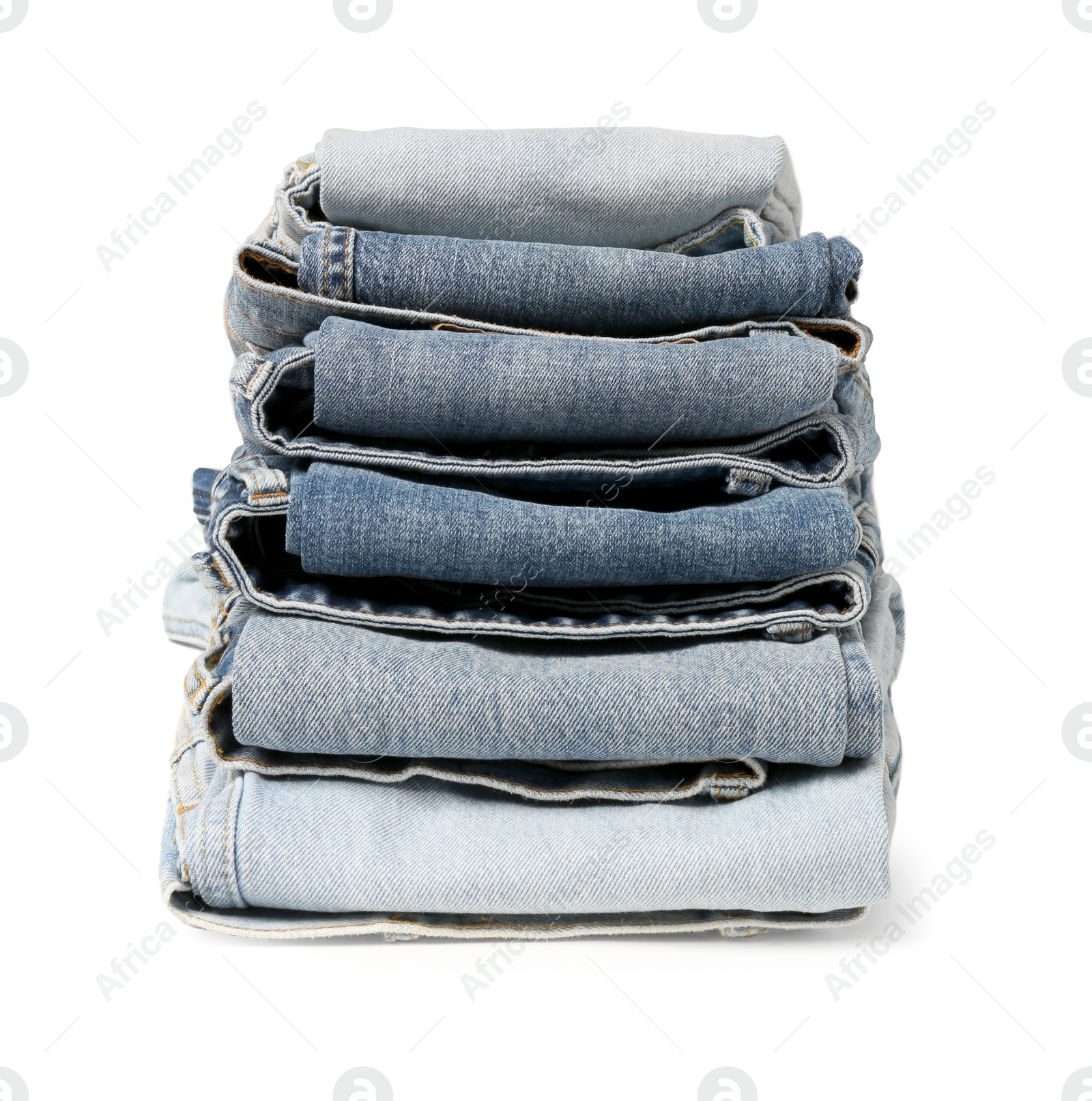 Photo of Stack of different folded jeans isolated on white