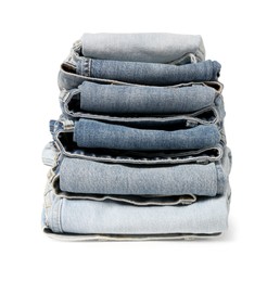 Photo of Stack of different folded jeans isolated on white