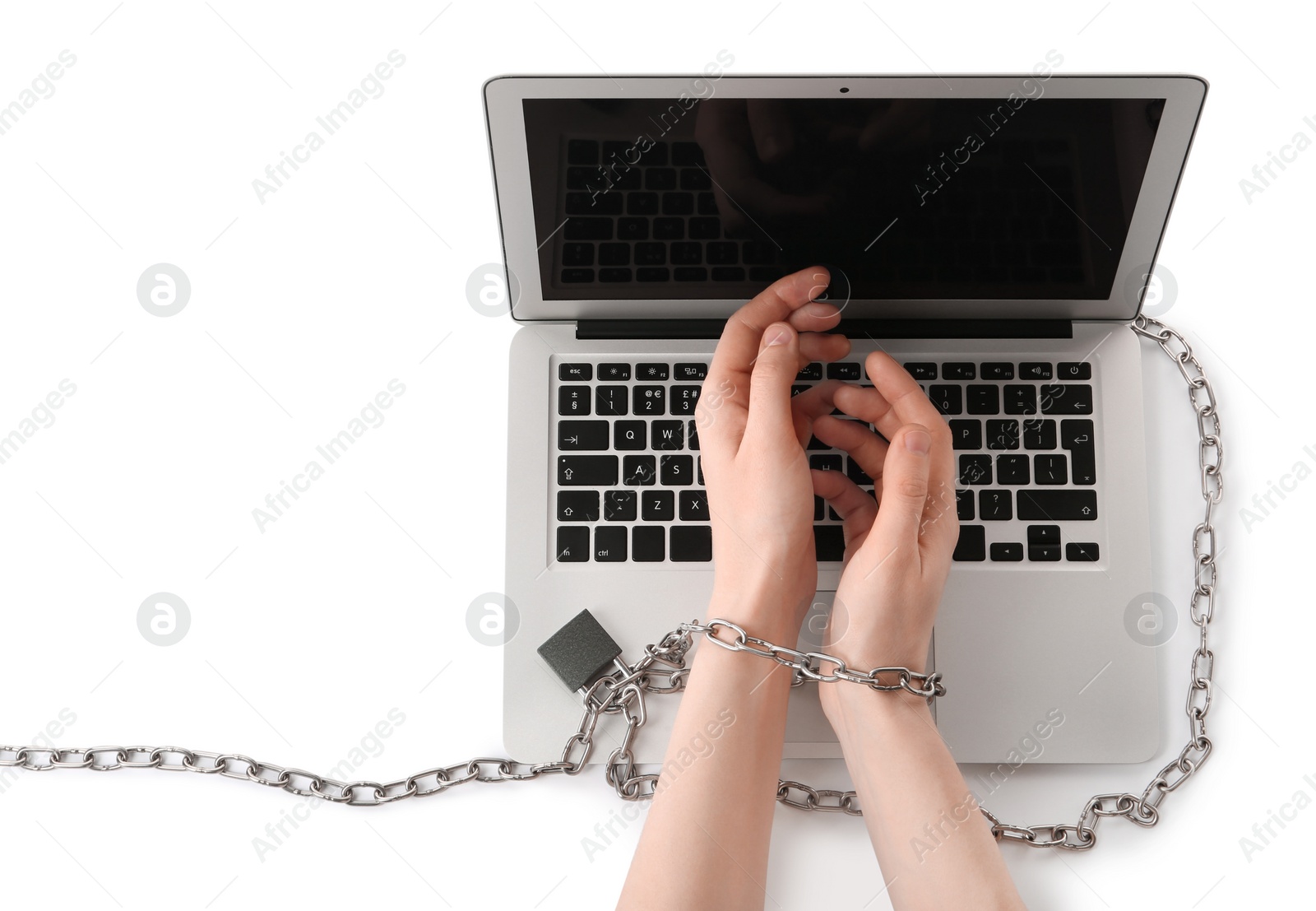 Photo of Woman showing hands chained to laptop on white background, top view. Internet addiction