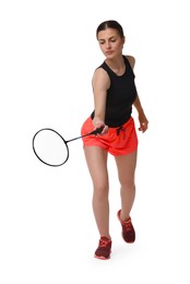 Young woman playing badminton with racket on white background