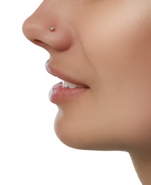 Photo of Young woman with nose piercing on white background, closeup