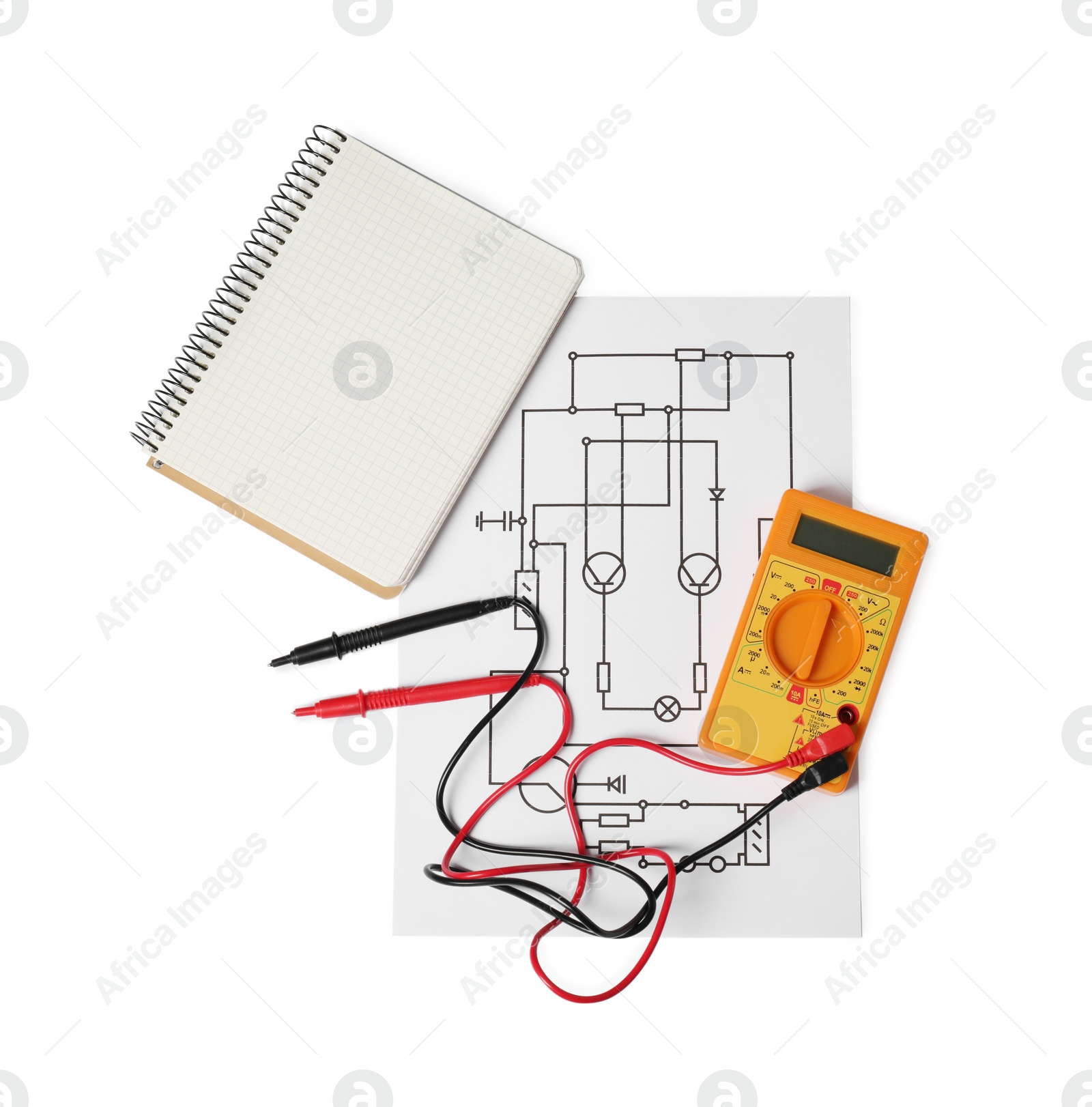 Photo of Wiring diagram, digital multimeter and notepad isolated on white, top view