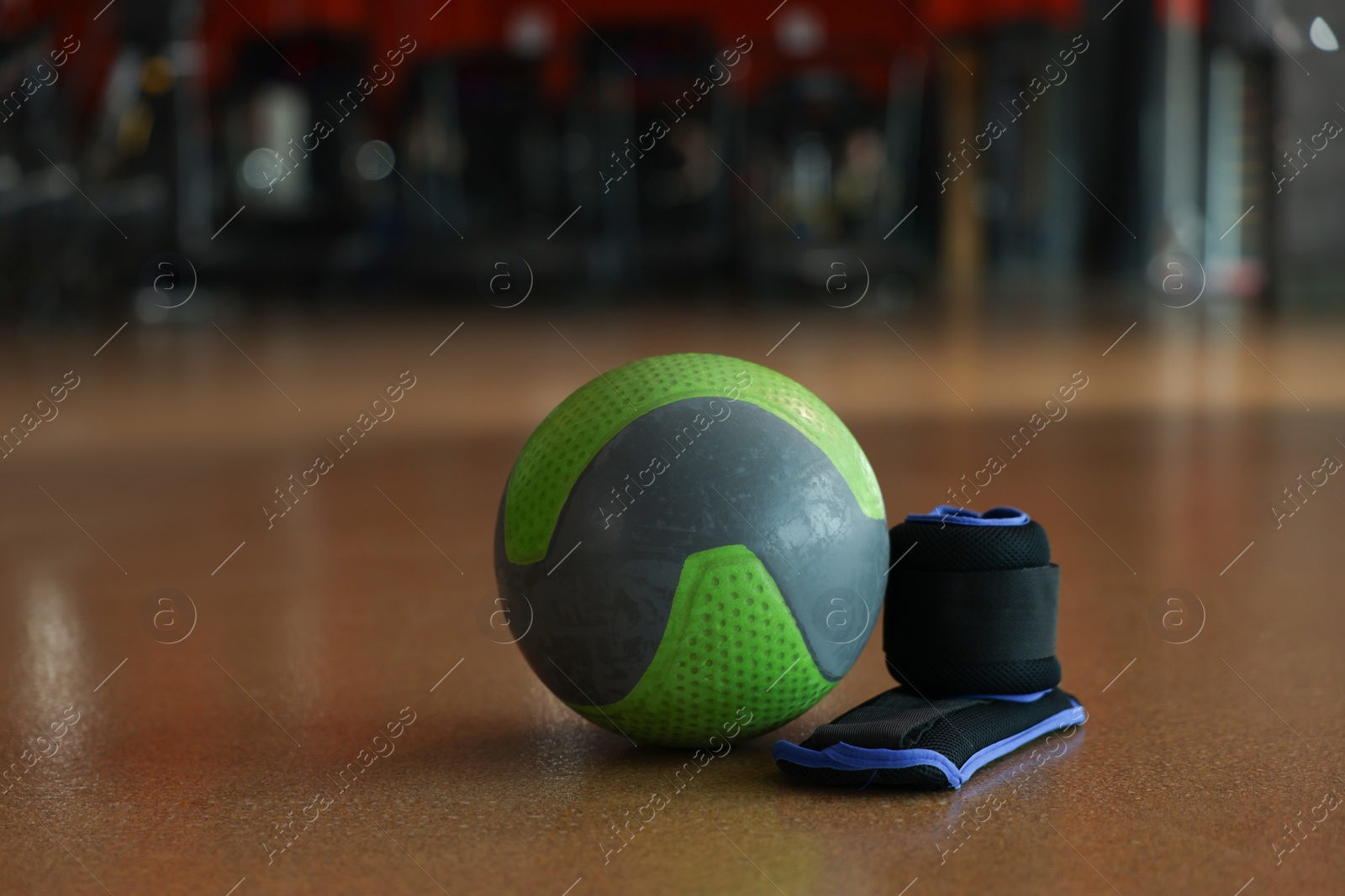 Photo of Medicine ball and weighting agents on floor in gym