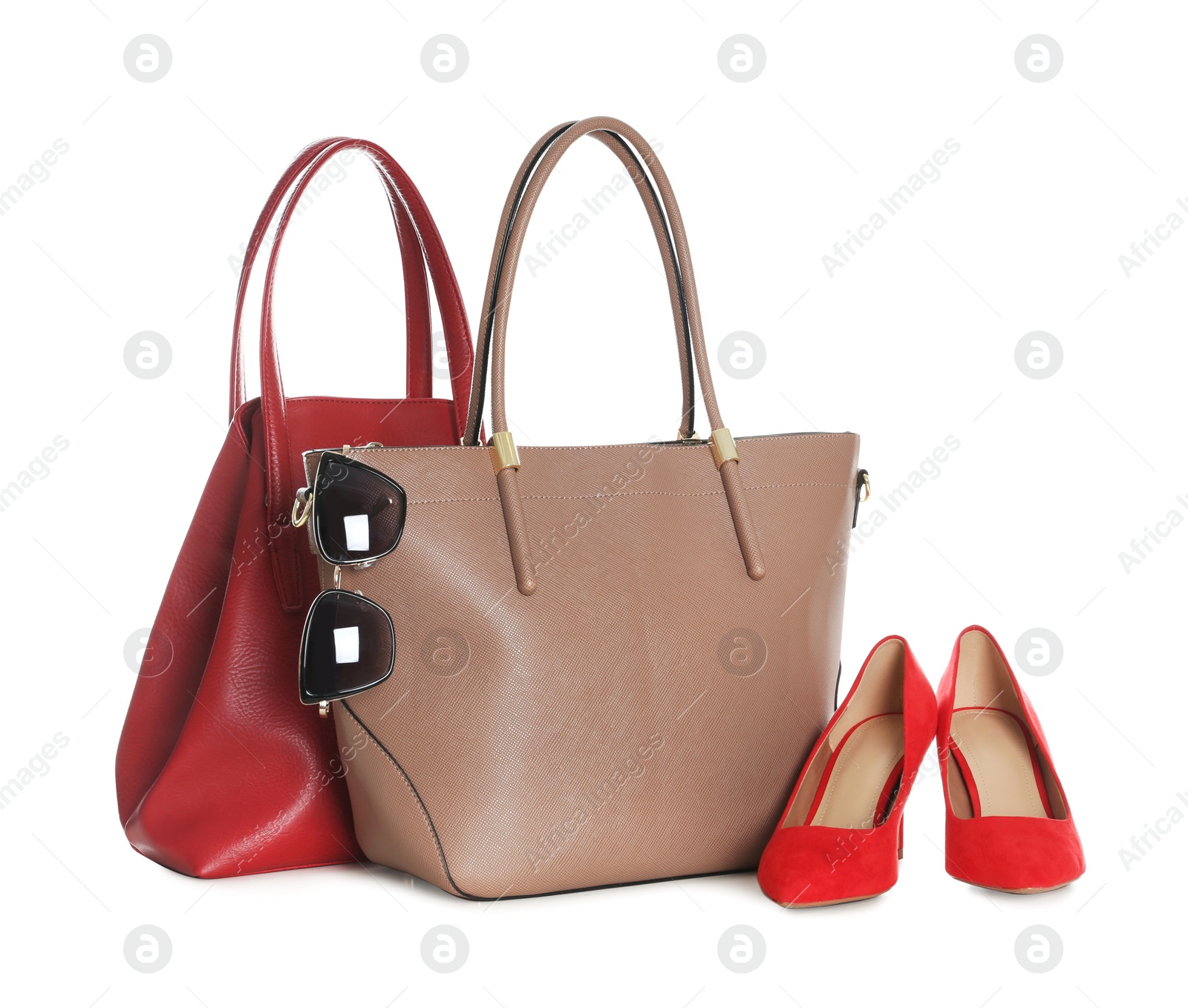 Photo of Different stylish woman's bags, shoes and sunglasses isolated on white