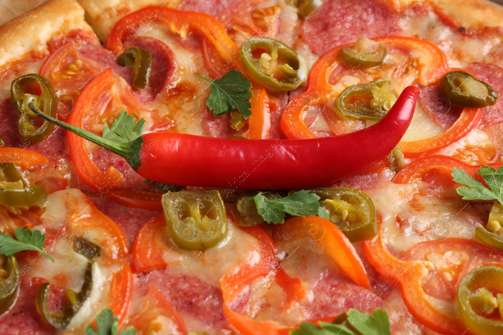 Photo of Delicious hot pizza Diablo as background, closeup