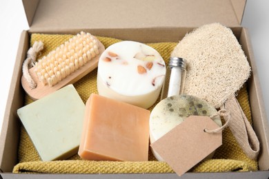 Photo of Cardboard box with eco friendly personal care products, closeup