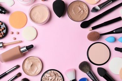 Photo of Flat lay composition with skin foundation, powder and beauty accessories on color background. Space for text