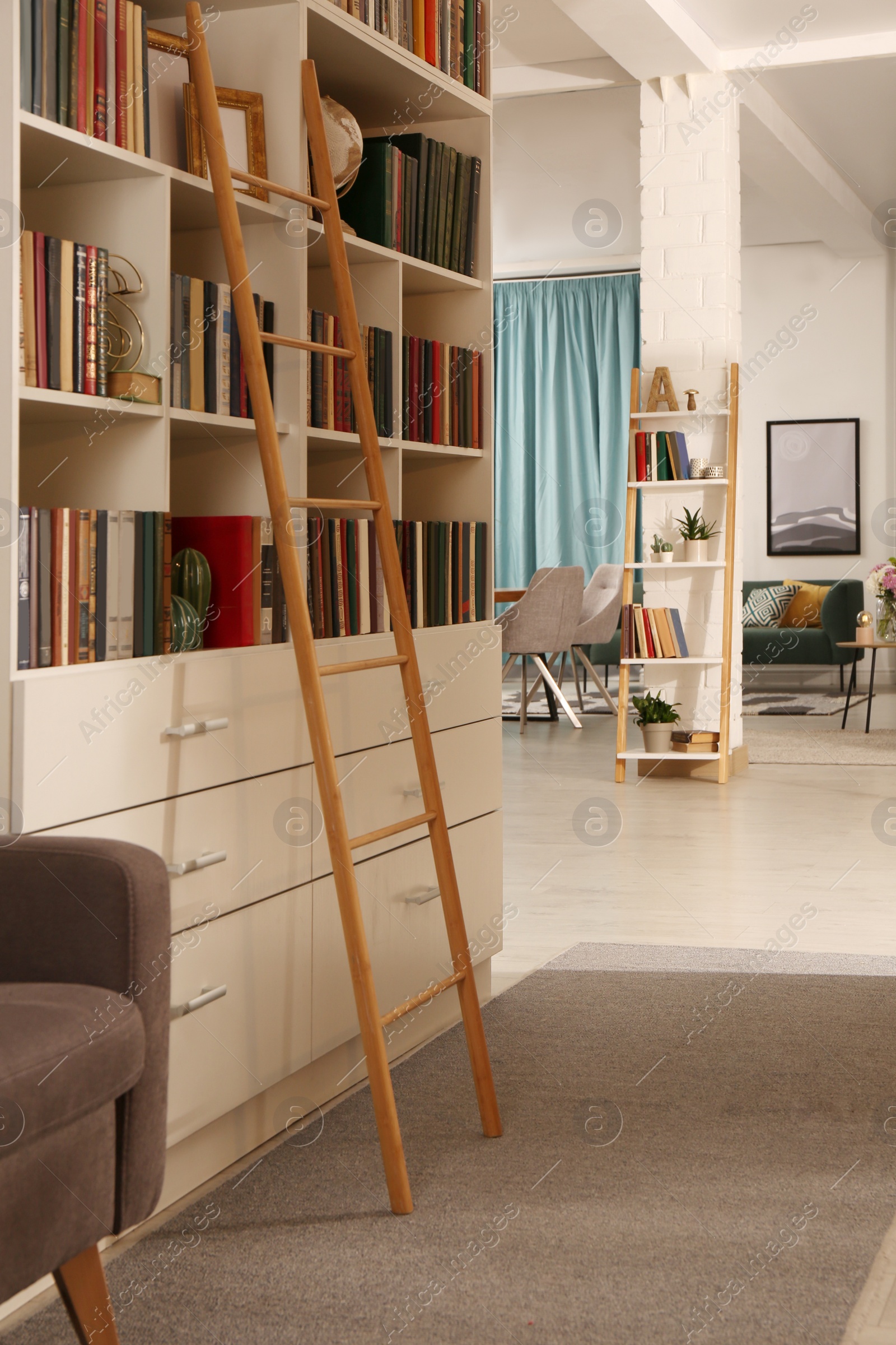 Photo of Home library interior with collection of different books on shelves