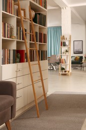 Home library interior with collection of different books on shelves