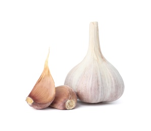 Fresh organic garlic bulb and cloves on white background