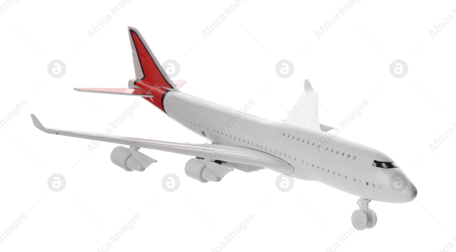 Photo of Toy airplane isolated on white. Travel concept