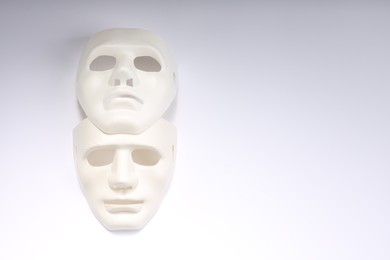 Theater arts. Two masks on white background, top view. Space for text