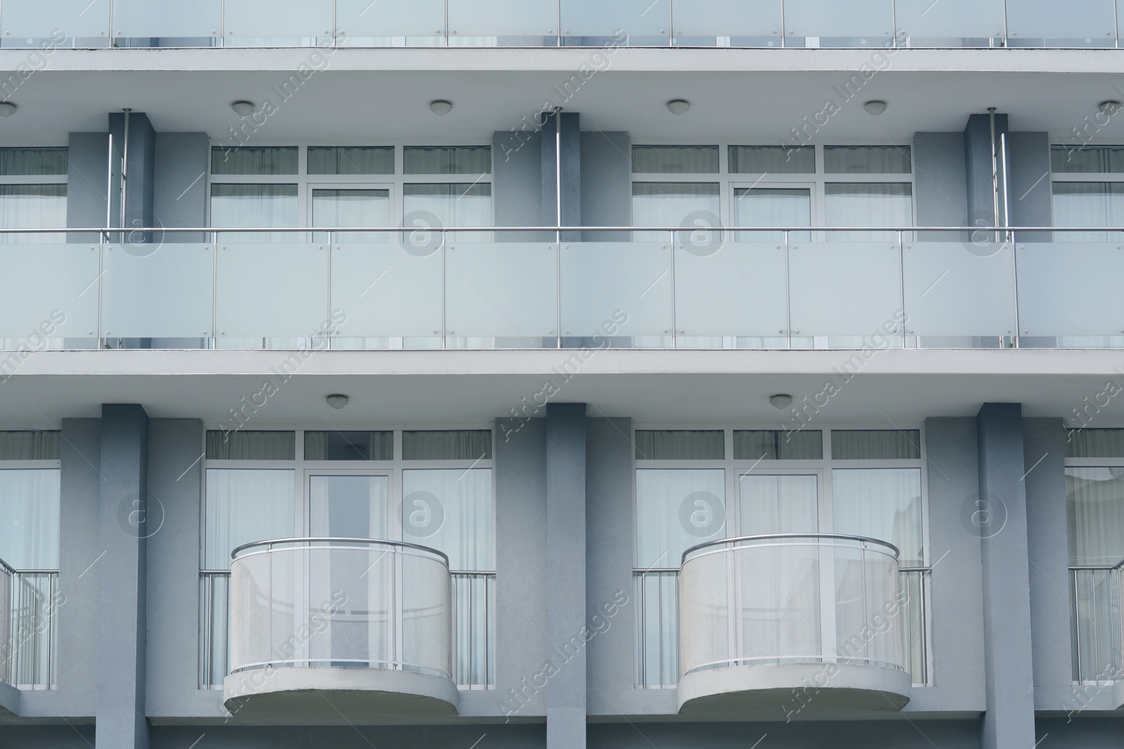 Photo of Exterior of beautiful building with different balconies