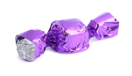 Tasty candy in purple wrapper isolated on white