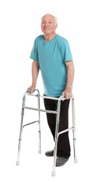 Photo of Full length portrait of elderly man using walking frame isolated on white