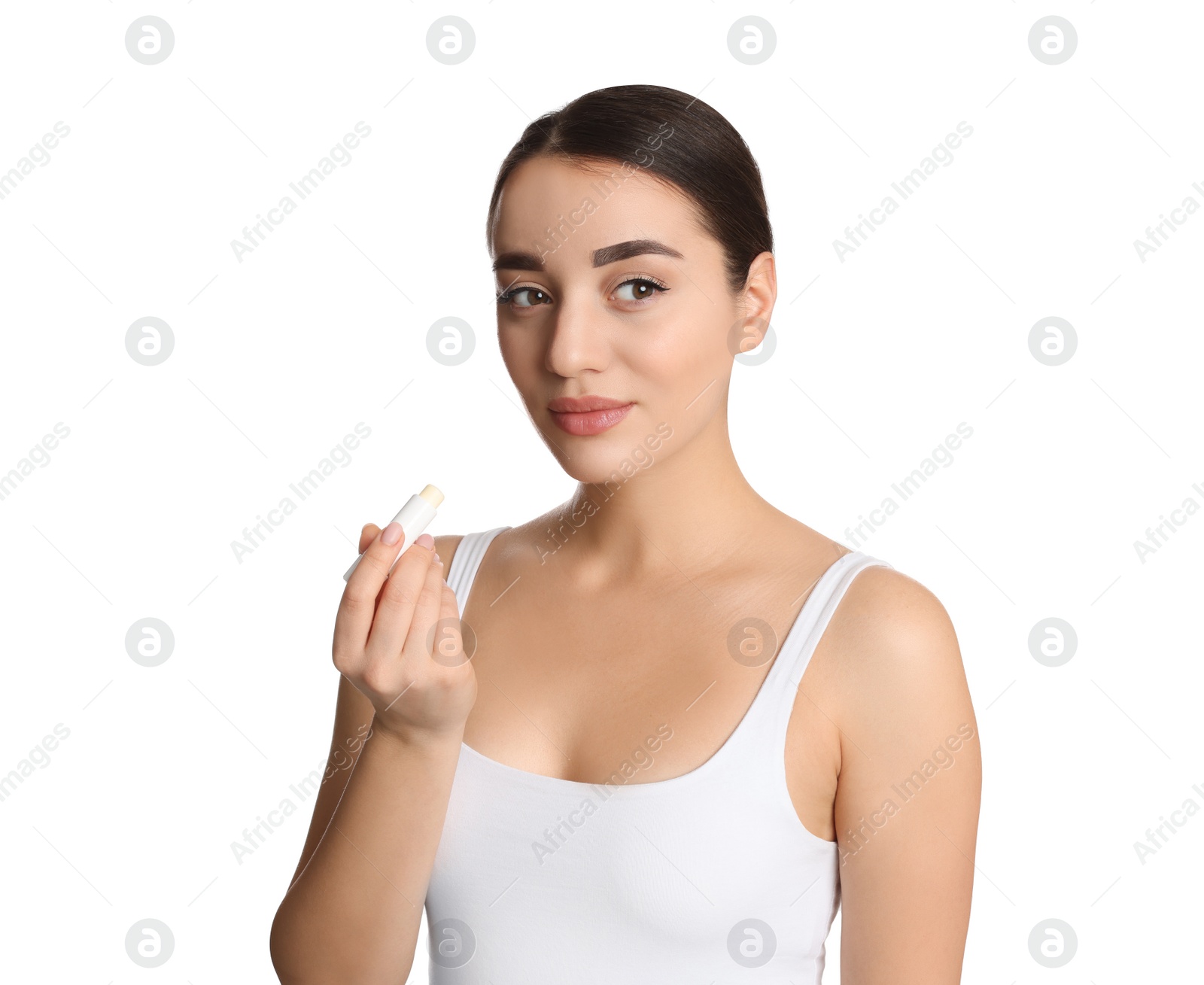 Photo of Young woman with lip balm on white background