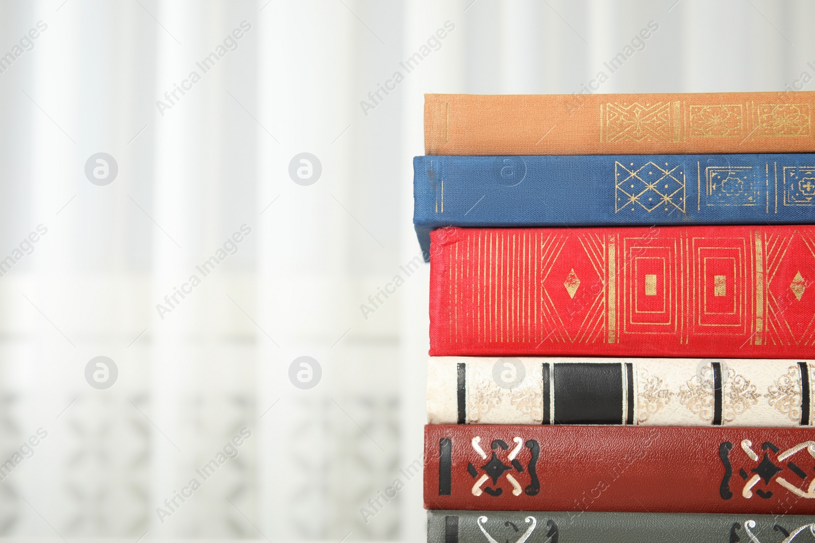 Photo of Collection of different books indoors, closeup. Space for text