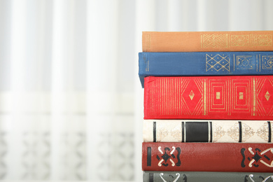 Photo of Collection of different books indoors, closeup. Space for text