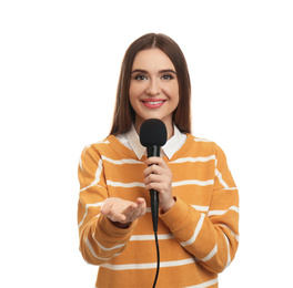 Young female journalist with microphone on white background