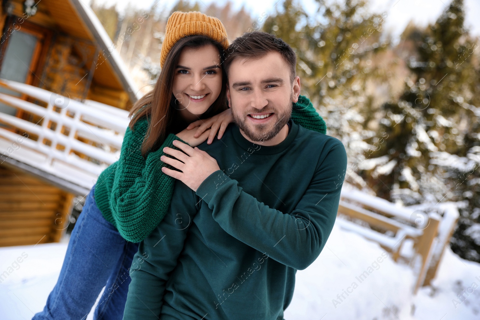 Photo of Lovely couple spending time together on snowy day. Winter vacation