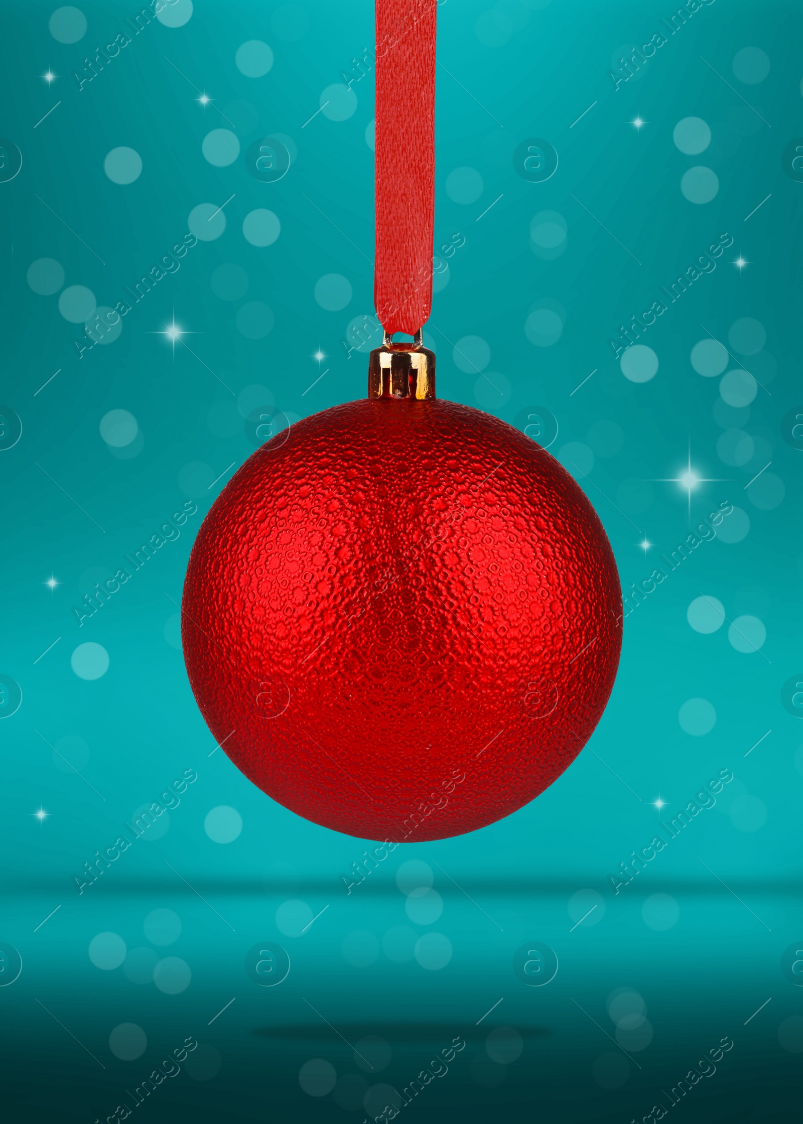 Image of Beautiful red Christmas ball hanging on color background