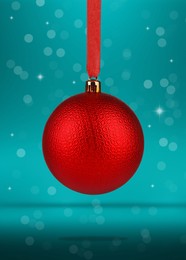 Beautiful red Christmas ball hanging on color background