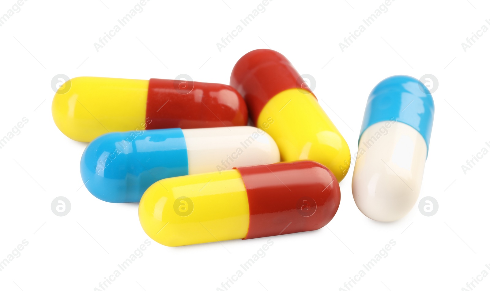 Photo of Many antibiotic pills isolated on white. Medicinal treatment