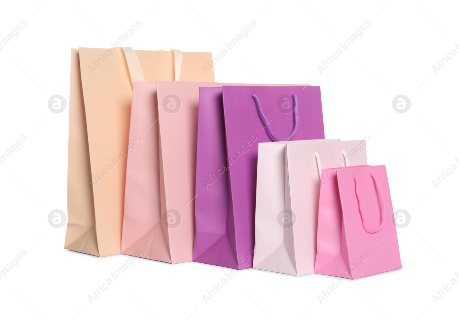 Photo of Colorful paper shopping bags isolated on white