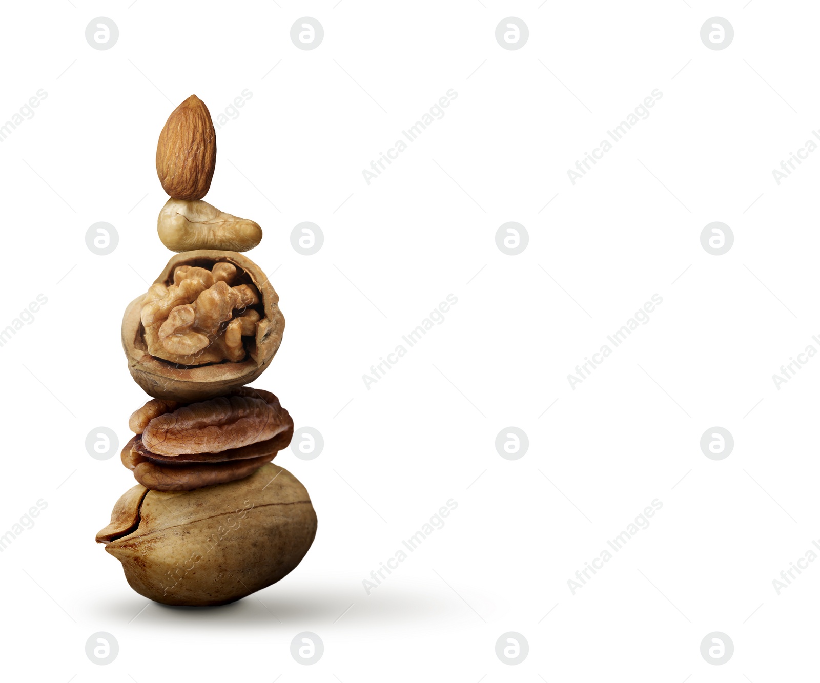 Image of Stack of different nuts on white background