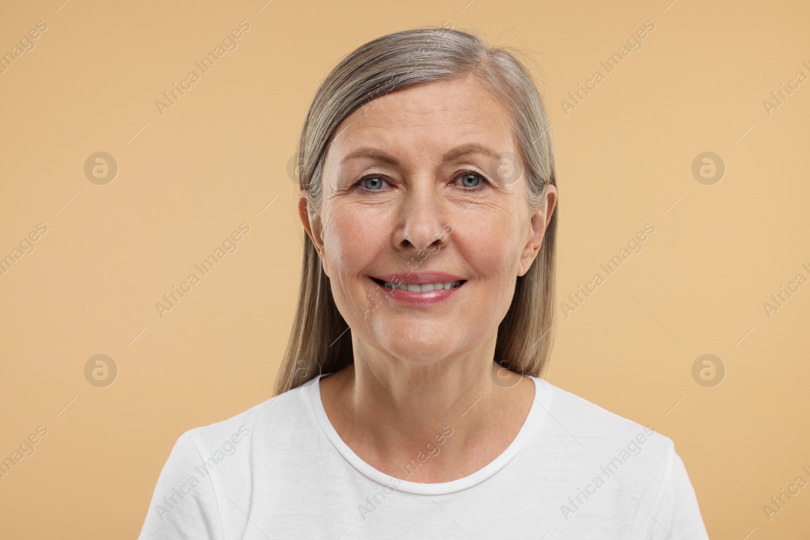 Photo of Beautiful woman with healthy skin on beige background