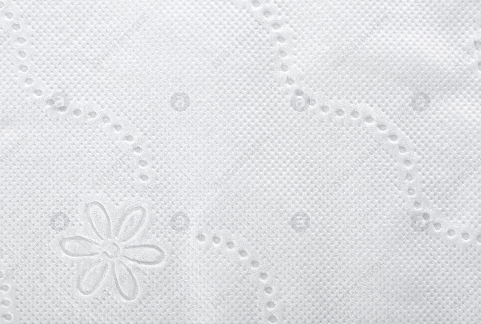 Photo of Perforated toilet paper as background, closeup. Personal hygiene